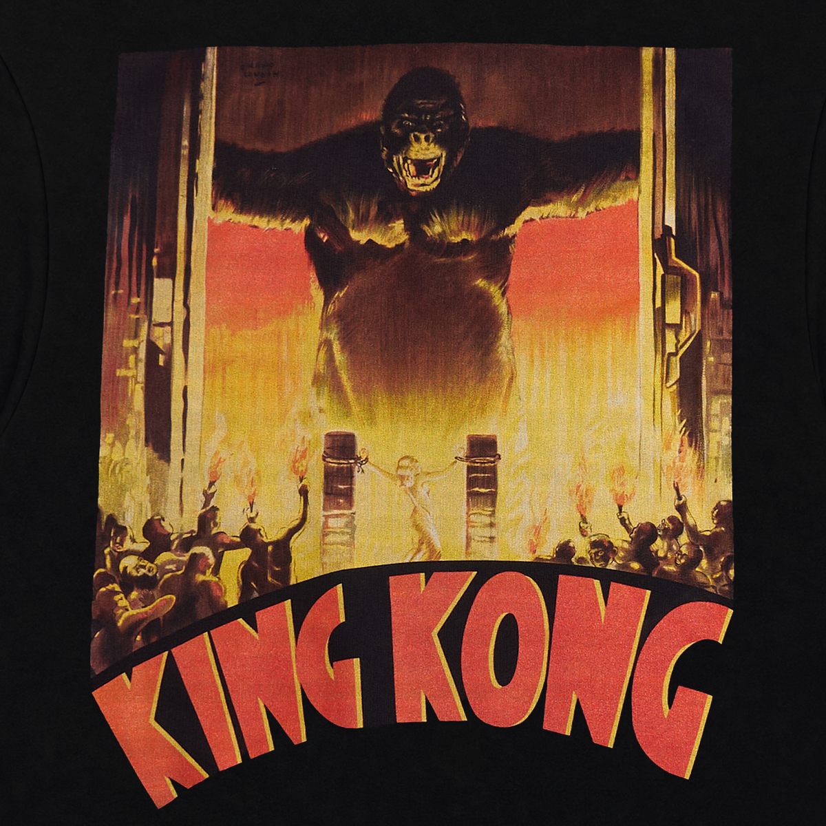 A close-up of a black T-shirt featuring a large graphic print of the King Kong movie artwork, with the title 'KING KONG' in bold red letters at the bottom.