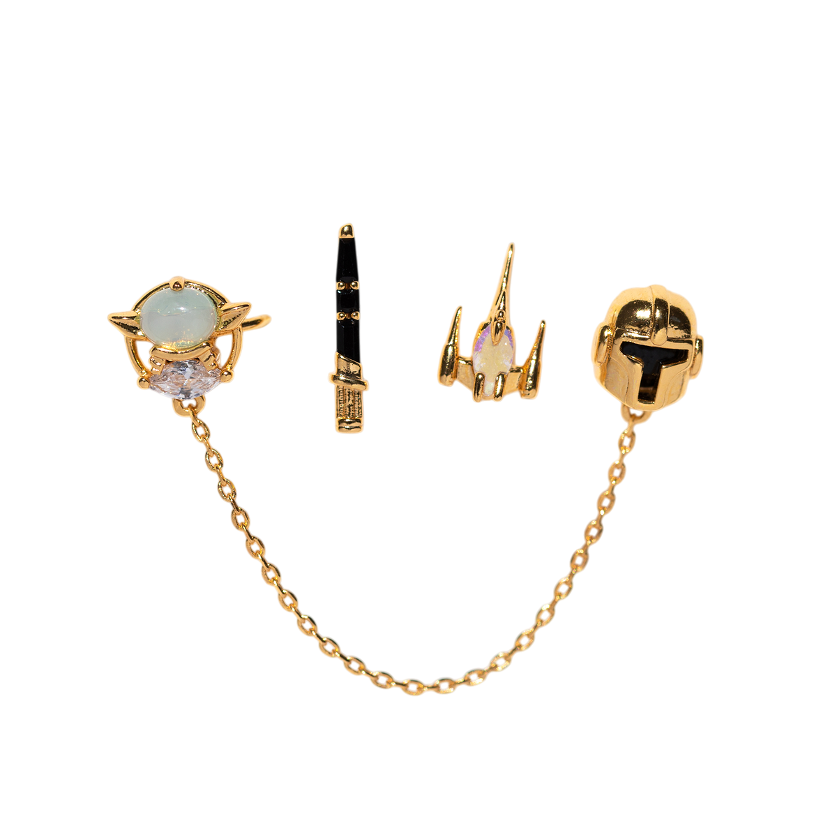 Four-piece gold-tone stud earring set featuring a helmet-inspired stud with chain detail, a starfighter motif, a lightsaber-inspired stud, and a celestial design with an iridescent cabochon and clear crystal accent, shown on a plain background.