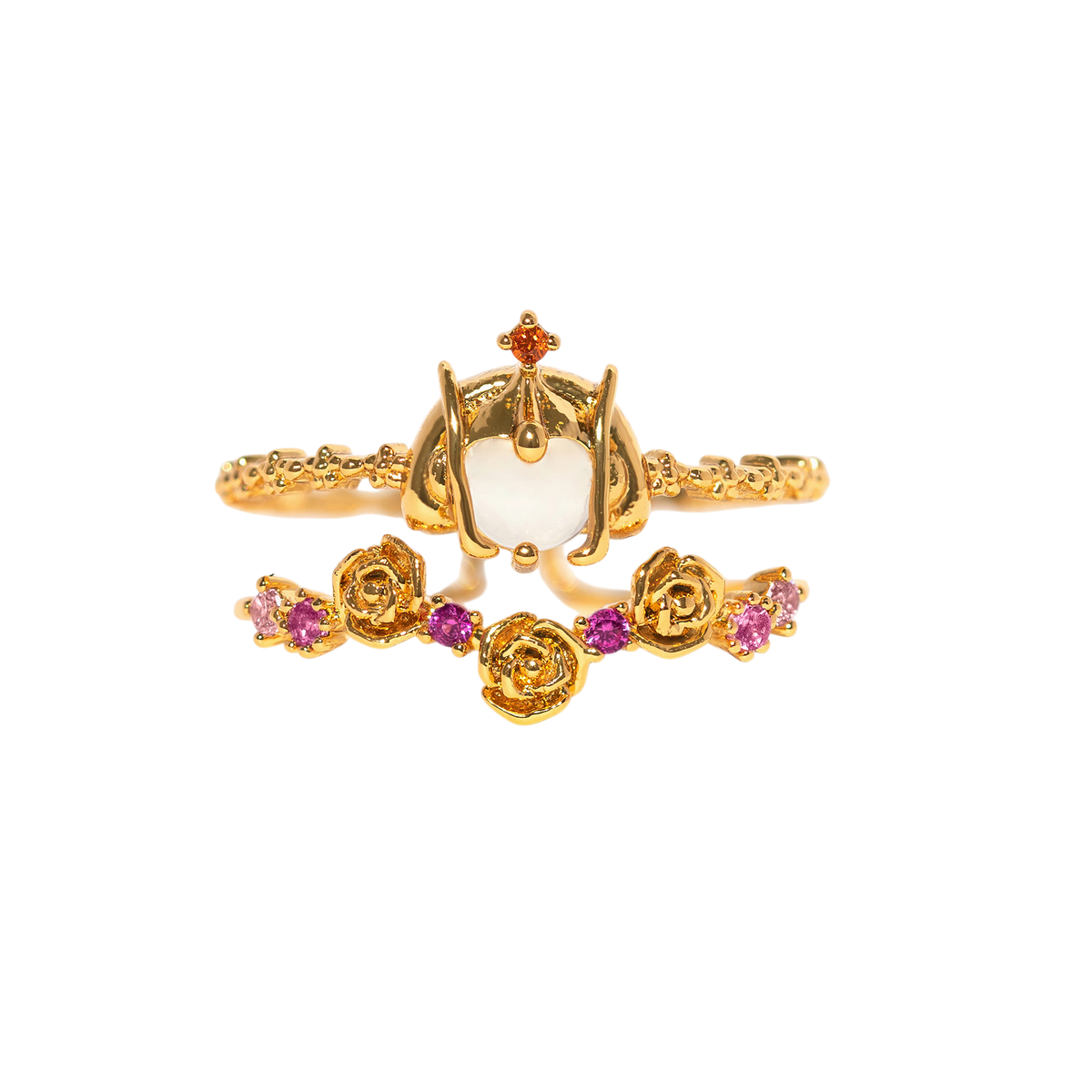 Two-piece gold-tone Padmé Amidala ring set featuring an ornate crown motif with a white stone and a matching rose-pattern band with pink gemstone accents, shown on a plain background.