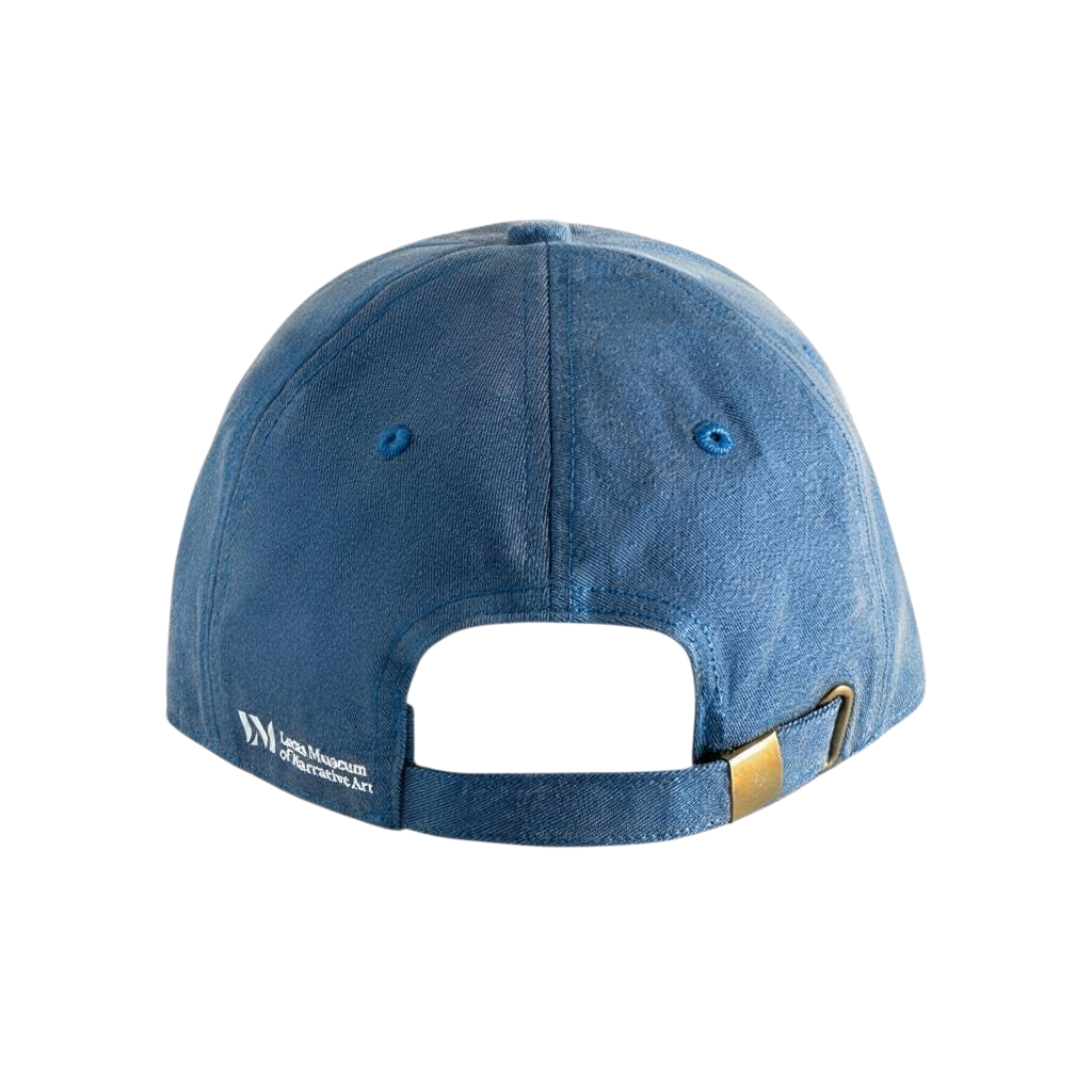 Side close-up of a washed cotton denim dad hat featuring a white Lucas Museum of Narrative Art logo and text.