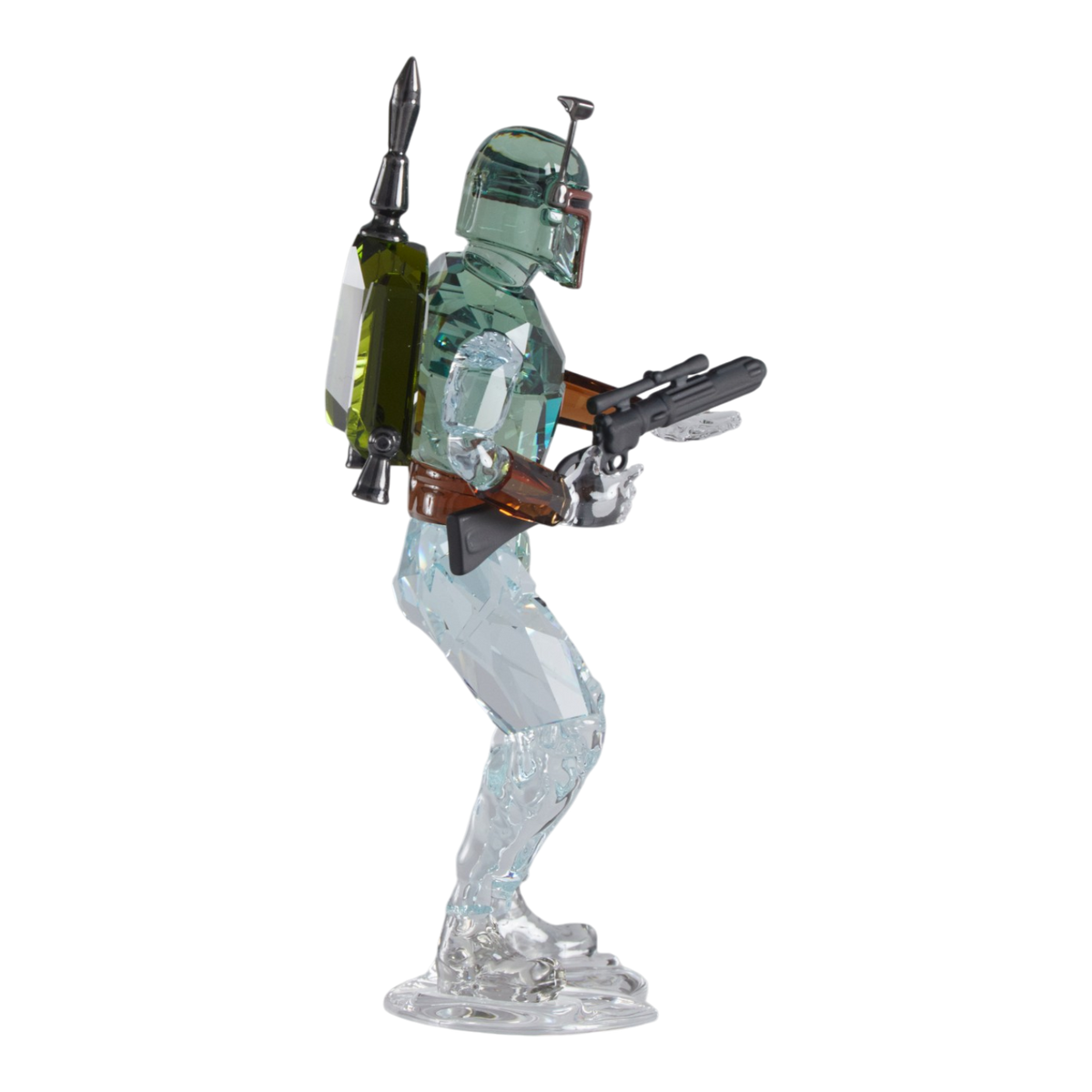 A clear faceted Swarovski crystal figurine of Boba Fett, holding a blaster, standing on a transparent base against a plain white background.