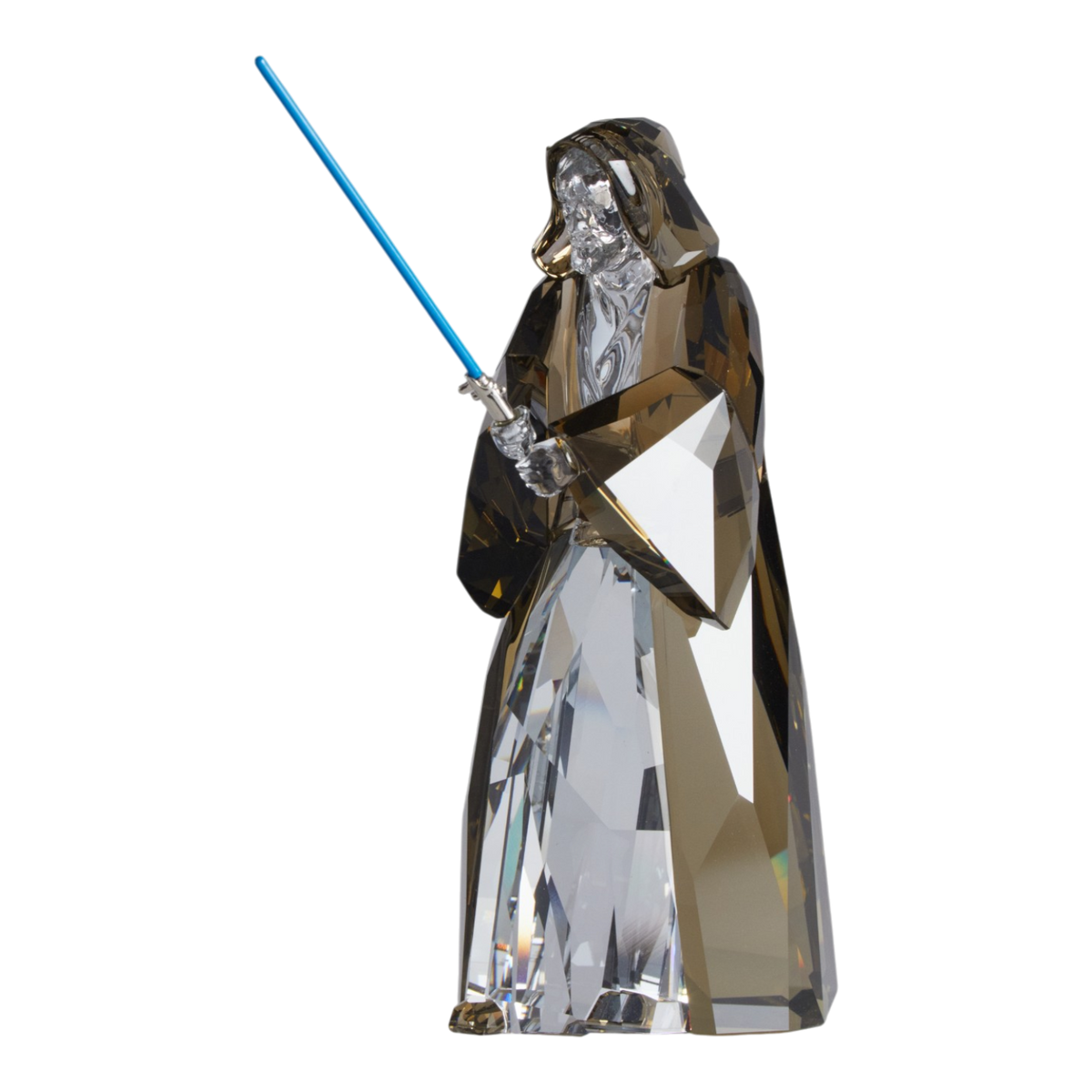 A clear faceted Swarovski crystal figurine of Obi-Wan Kenobi holding a blue lightsaber, standing on a transparent base against a plain white background.