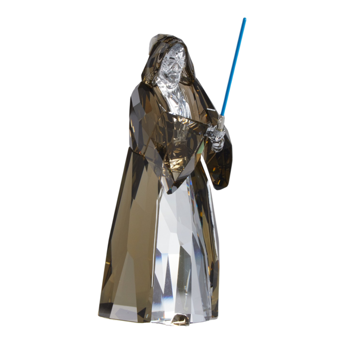 A clear faceted Swarovski crystal figurine of Obi-Wan Kenobi holding a blue lightsaber, standing on a transparent base against a plain white background.