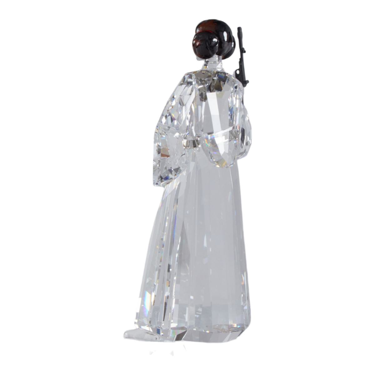 A clear faceted Swarovski crystal figurine of Princess Leia holding a black lacquered metal gun, standing on a transparent base against a plain white background.