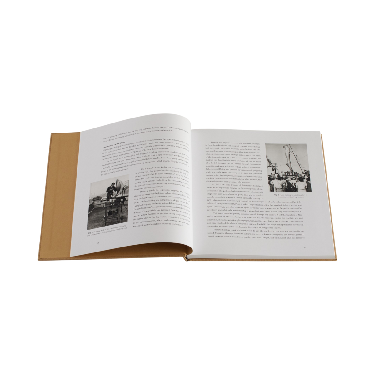 An open hardcover book with tan leather-like covers and printed pages featuring black-and-white photographs and dense text, shown on a plain white background.