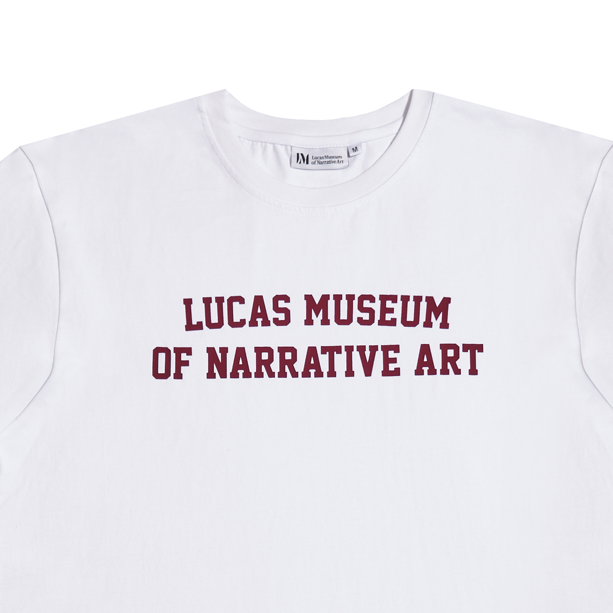 A white crewneck t-shirt featuring the text 'LUCAS MUSEUM OF NARRATIVE ART' printed in maroon across the chest.