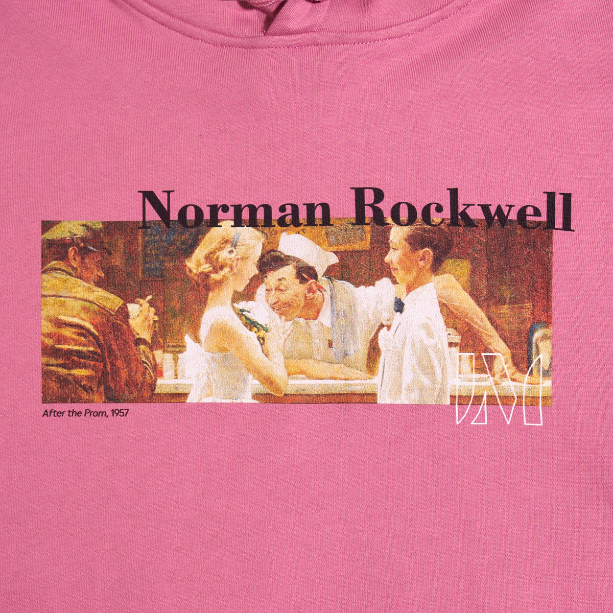 A close-up of a pink t-shirt featuring a graphic print of Norman Rockwell's famous 1957 'After the Prom' illustration. The graphic includes the text 'Norman Rockwell' in black and the iconic white 'Lucas Museum of Narrative Art' logo, set against the warm tones of the vintage illustration.