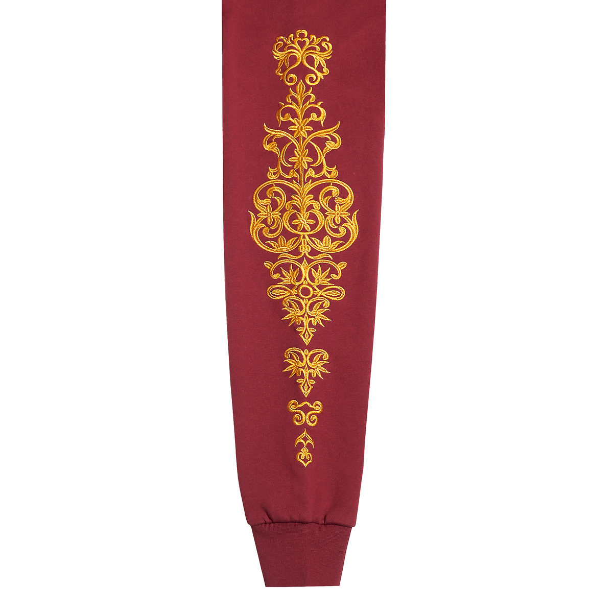 A close-up of a sleeve featuring a prominent vertical gold ornamental baroque-style pattern on the front, set against a plain white background.