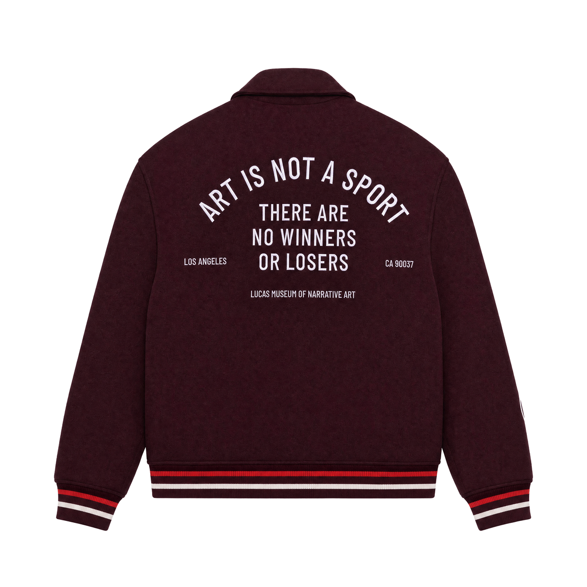 A dark burgundy varsity-style jacket shown from the back, featuring white text that reads 'ART IS NOT A SPORT THERE ARE NO WINNERS OR LOSERS' with smaller text below reading, 'Lucas Musuem of Narrative Art,' and red and white striped ribbed cuffs and hem.