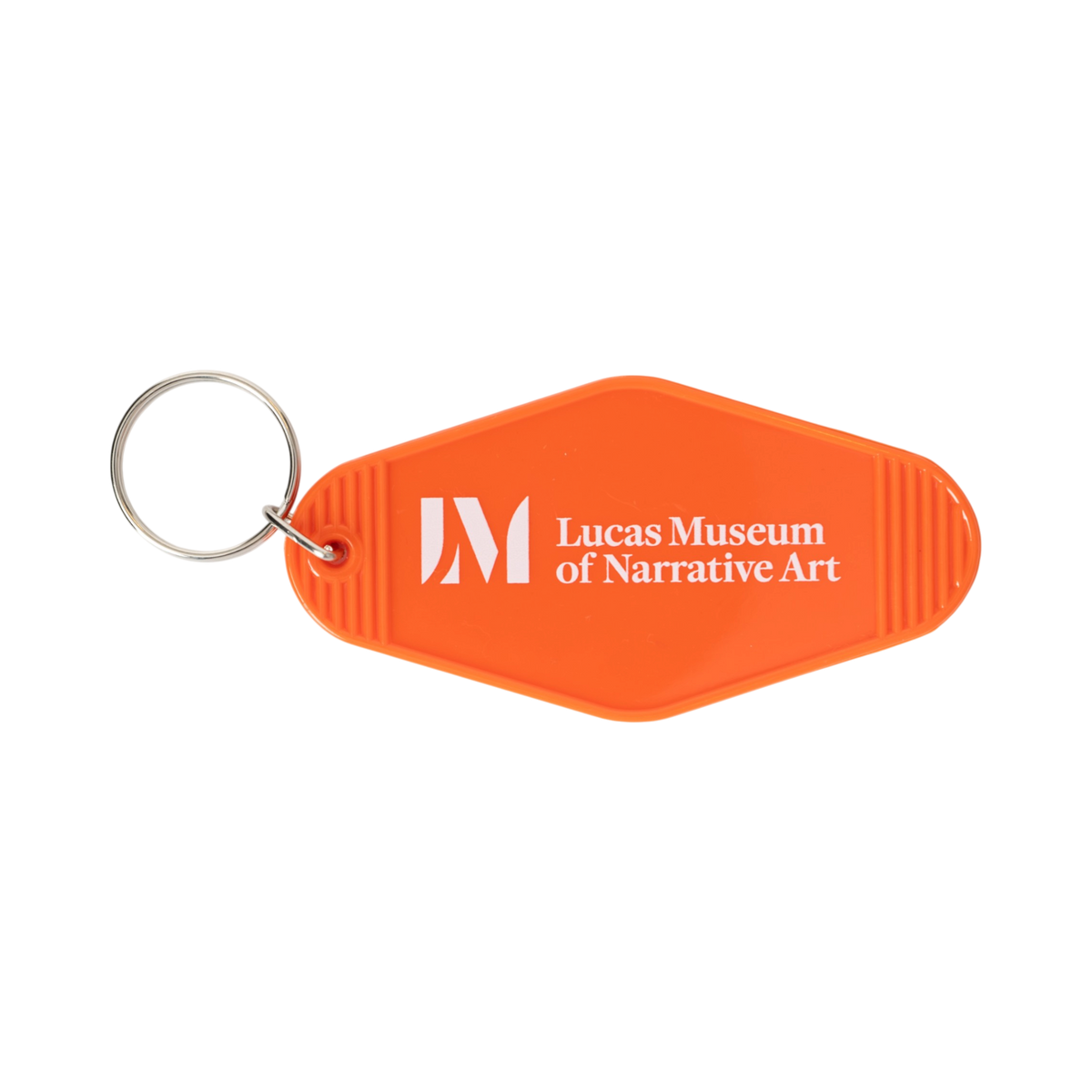 3.5" x 1.8" retro motel key tag in LMNA orange, featuring white “Storyteller” text on the front and the Lucas Museum of Narrative Art name and logo on the back. Includes a silver-tone split ring and is shown on a plain white background.
