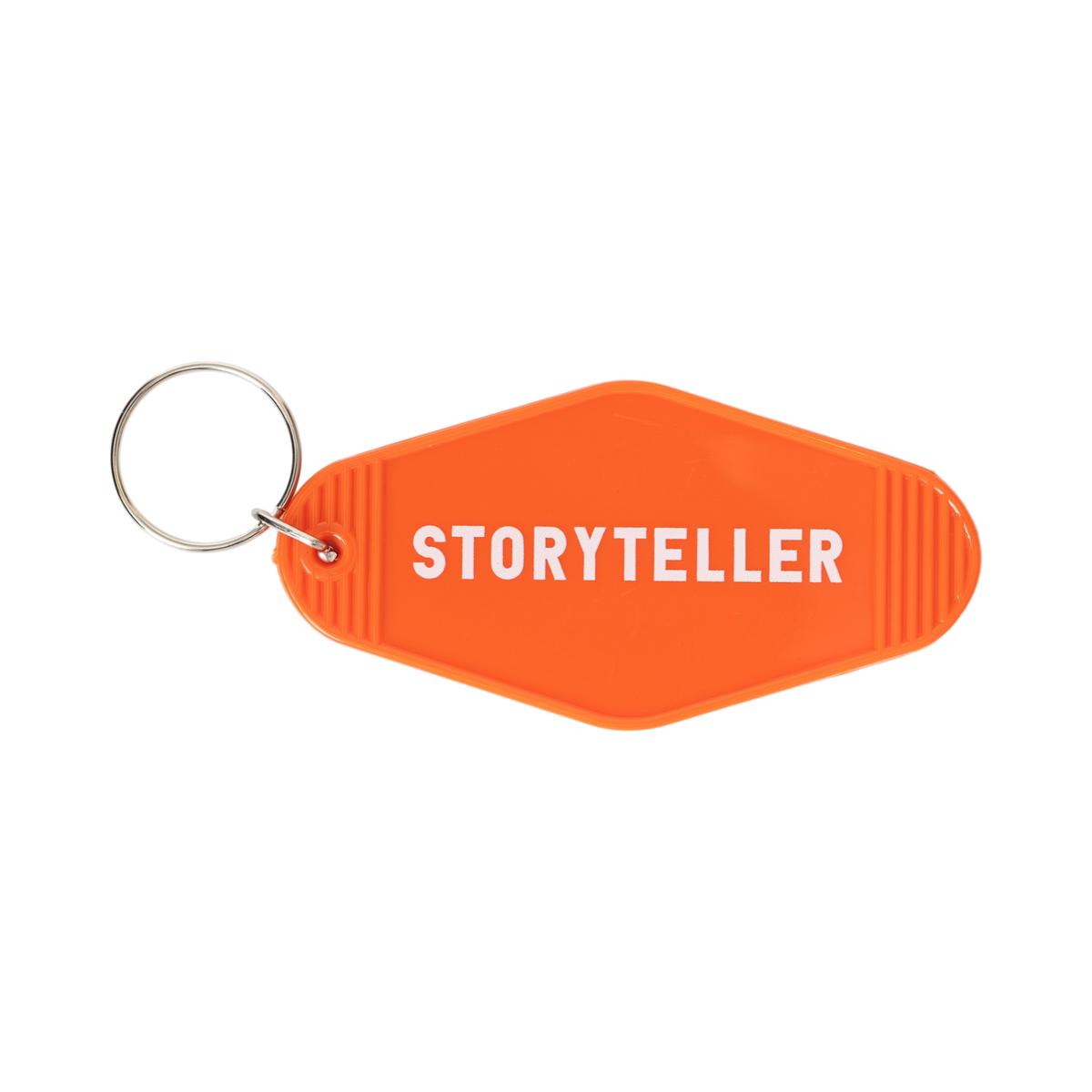 3.5" x 1.8" retro motel key tag in LMNA orange, featuring white "Storyteller" text on the front and a silver-tone split ring, shown on a plain white background.