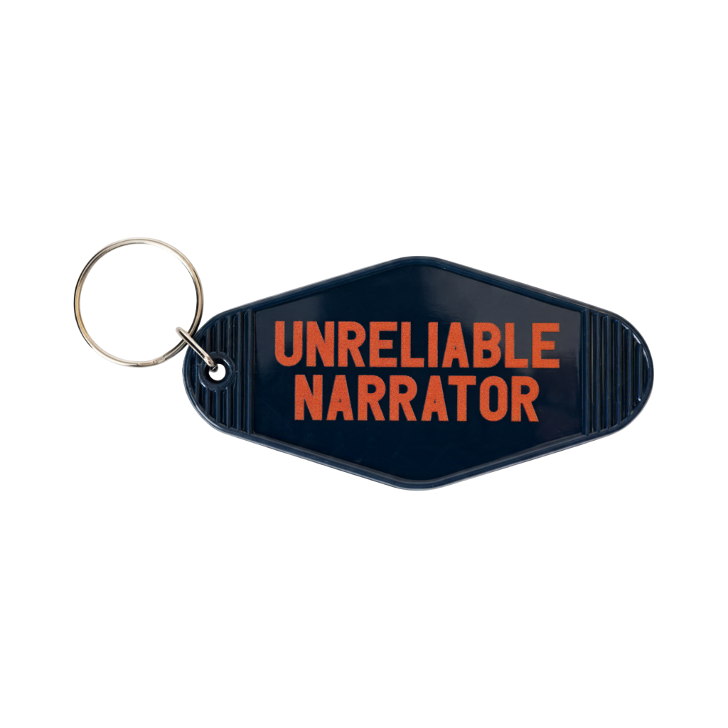3.5" x 1.8" retro dark blue motel key tag, featuring orange “Unreliable Narrator” text on the front and the Lucas Museum of Narrative Art name and logo on the back. Includes a silver-tone split ring and is shown on a plain white background.