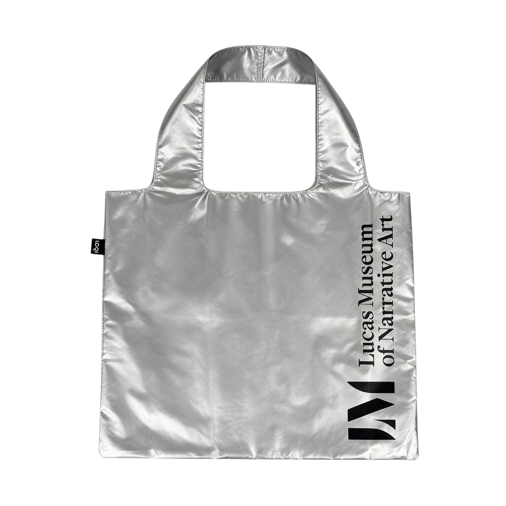 A metallic silver reusable tote bag with black printed text reading 'Lucas Museum of Narrative Art' and a large black 'LM' logo on the right side.