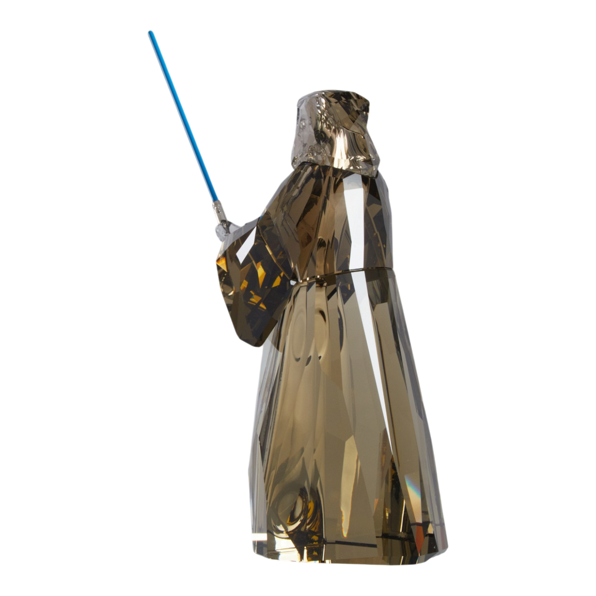 A clear faceted Swarovski crystal figurine of Obi-Wan Kenobi holding a blue lightsaber, standing on a transparent base against a plain white background.
