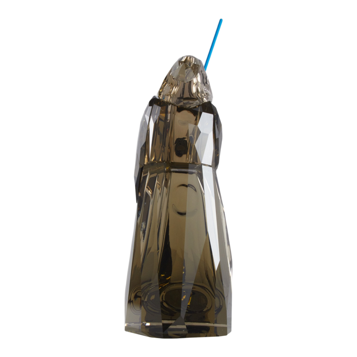 A clear faceted Swarovski crystal figurine of Obi-Wan Kenobi holding a blue lightsaber, standing on a transparent base against a plain white background.