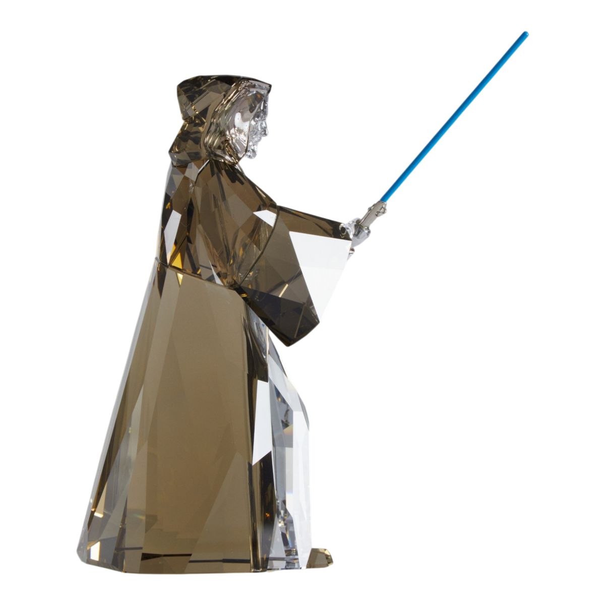 A clear faceted Swarovski crystal figurine of Obi-Wan Kenobi holding a blue lightsaber, standing on a transparent base against a plain white background.