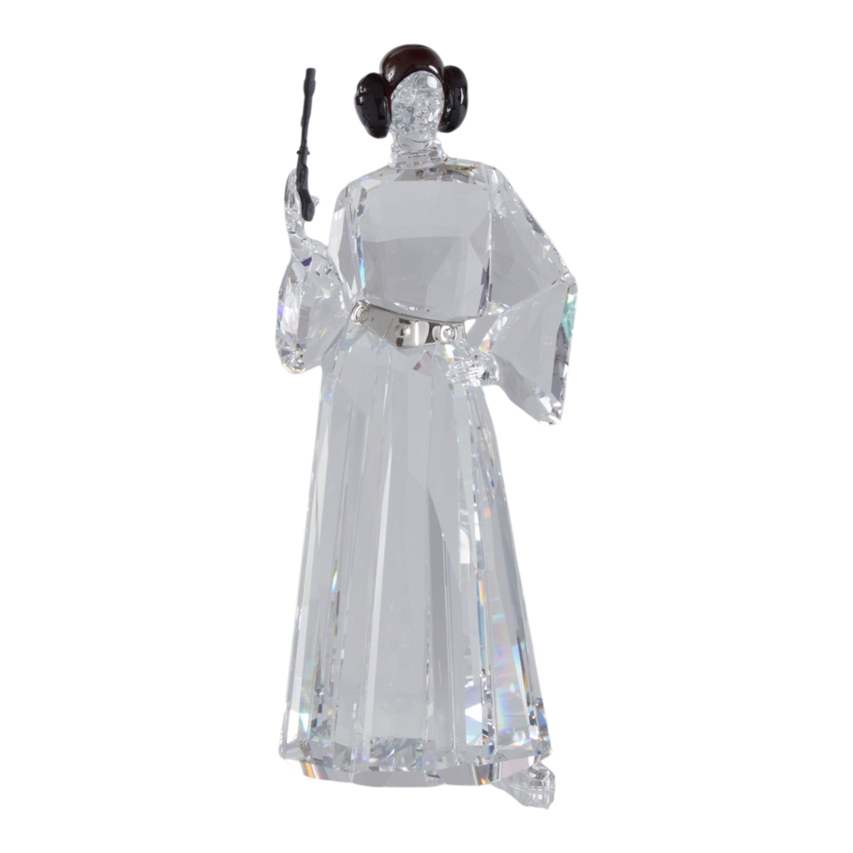 A clear faceted Swarovski crystal figurine of Princess Leia holding a black lacquered metal gun, standing on a transparent base against a plain white background.
