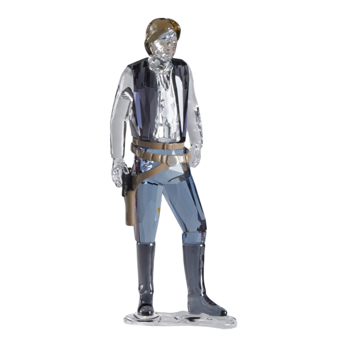 A clear faceted Swarovski crystal figurine of Hans Solo standing on a transparent base against a plain white background.