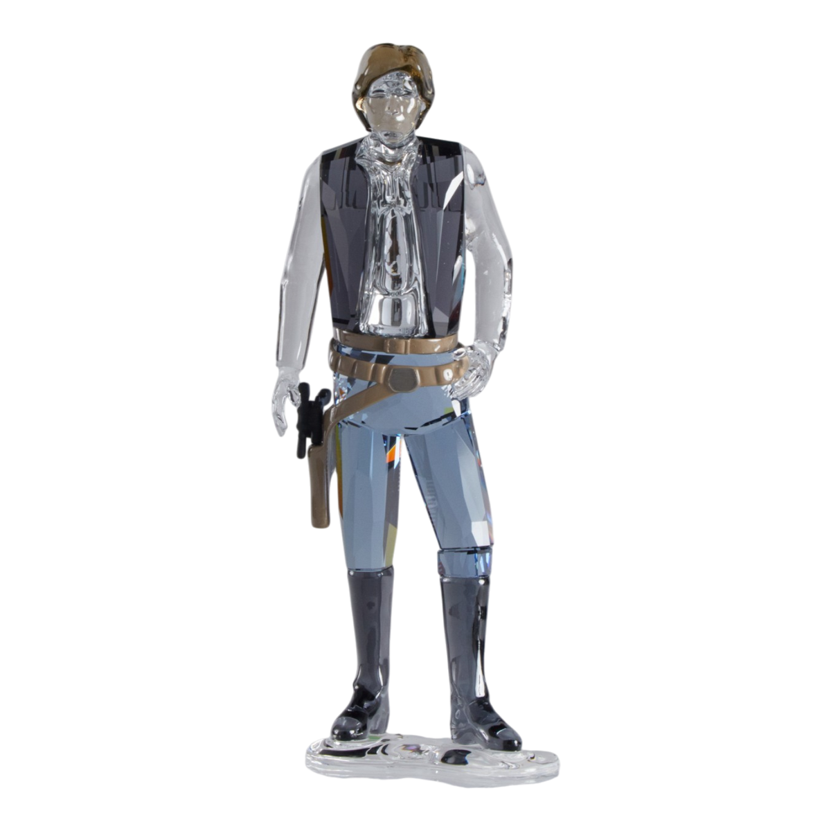 A clear faceted Swarovski crystal figurine of Hans Solo standing on a transparent base against a plain white background.