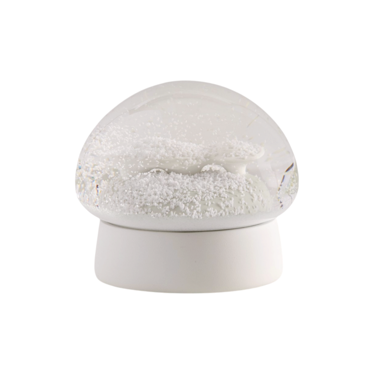 A white snow globe with white faux snow.