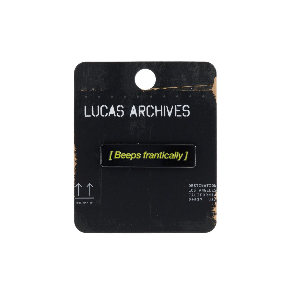 A black rectangular enamel pin with yellow text reading '[Beeps frantically]' mounted on a black display card labeled 'LUCAS ARCHIVES'.