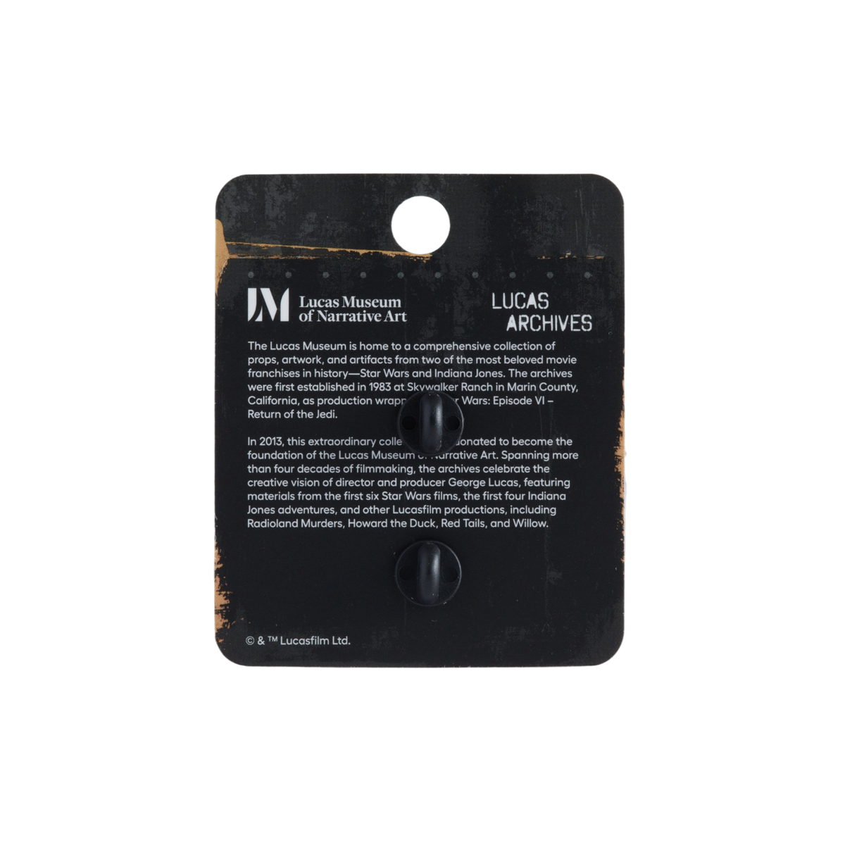 A black display card featuring printed text for Lucas Museum of Narrative Art and Lucas Archives, with a small circular cutout near the bottom center, shown against a plain white background.