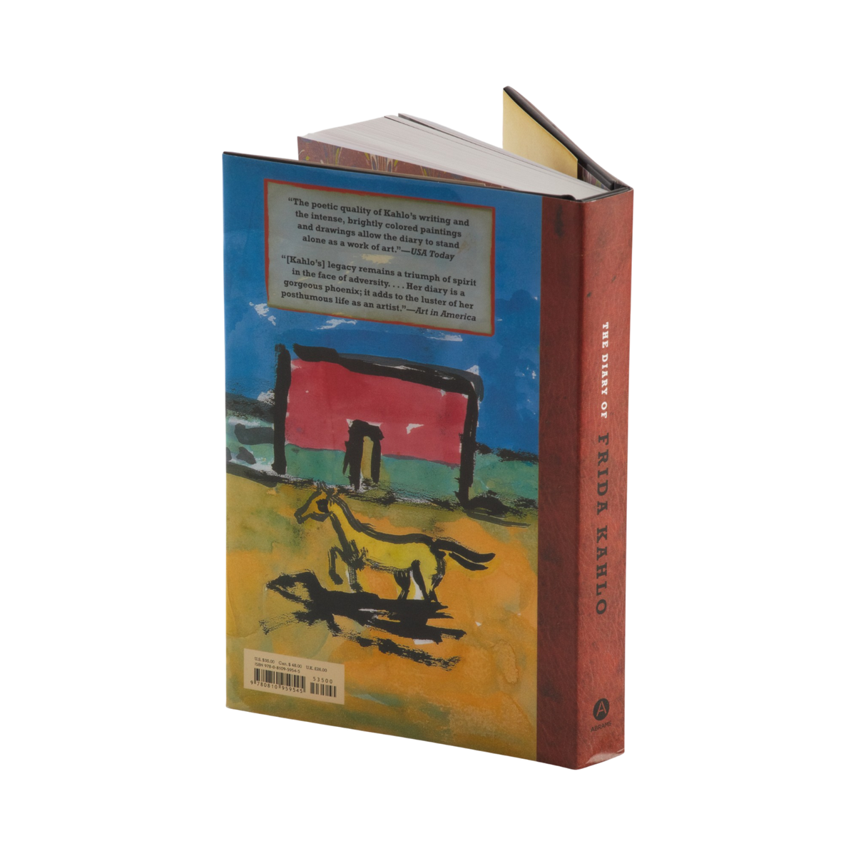 The back cover and spine of the book 'The Diary of Frida Kahlo' are shown, featuring a colorful painting of a horse in a field under a blue sky, with a reddish-brown spine.
