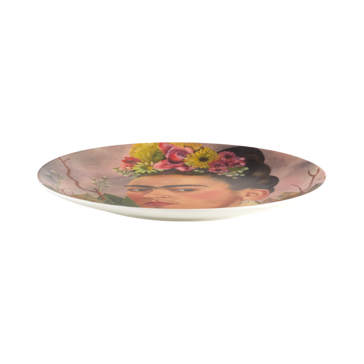 A white ceramic plate featuring a printed portrait of Frida Kahlo with colorful flowers in her hair, shown against a plain white background.