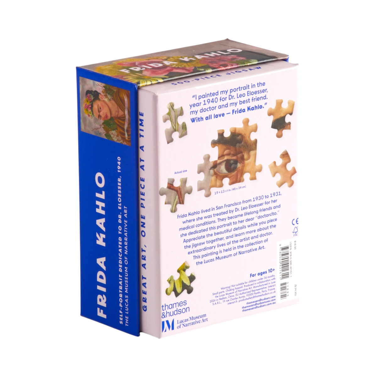 Frida Kahlo boxed puzzle shown at an angle with the front cover, spine, and back panel visible. The box is predominantly white with a bright blue vertical band on the left side and small yellow puzzle-piece graphics near the bottom.
