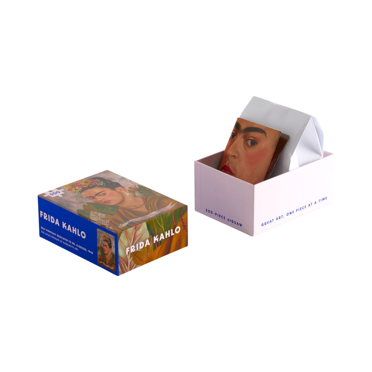 Two Frida Kahlo art cards in packaging, shown on a clean white background. One card is in a blue box with Frida Kahlo artwork, and the other is in a pale pink box with a folded cover and the card peeking out.