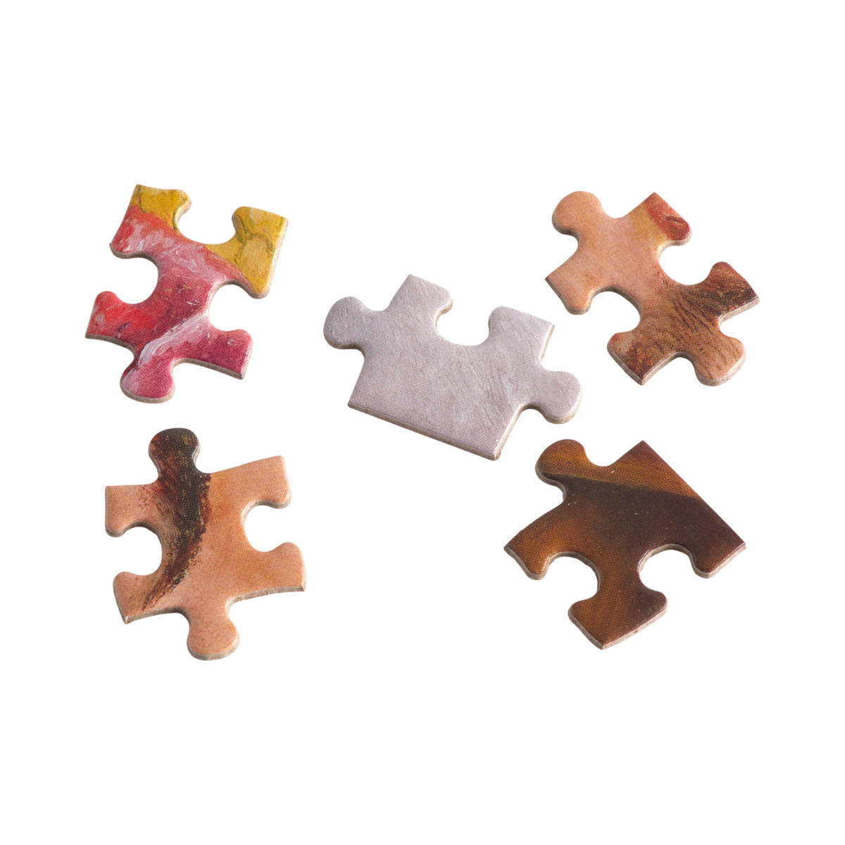 Five decorative jigsaw puzzle pieces with a marbled wood grain pattern in shades of brown, beige, and red, alongside one plain light gray piece, arranged on a solid white background.
