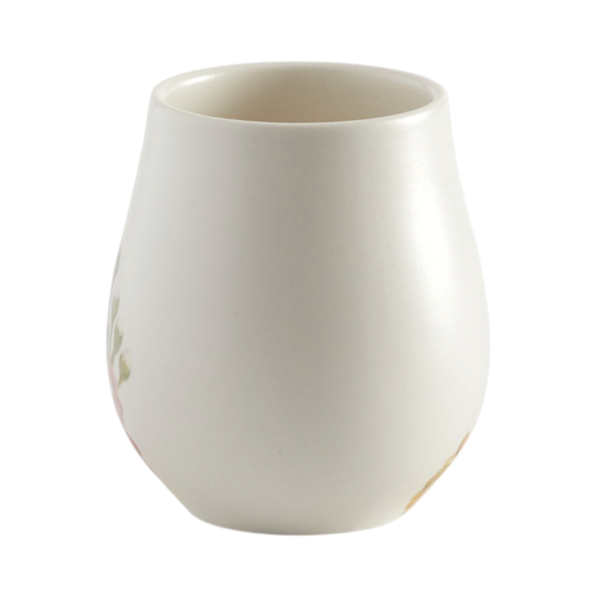 A small  mug with a rounded, bulbous shape in a glossy off-white finish, featuring subtle floral details on the sides, set against a plain white background.