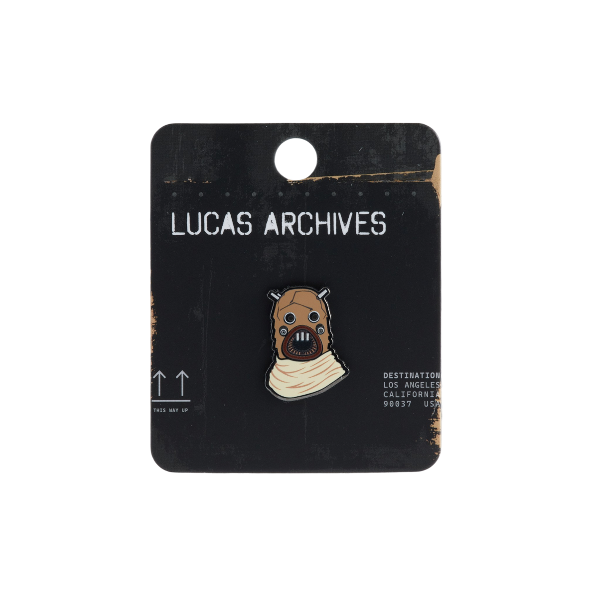 A Lucas Archives enamel pin featuring Tusken Raider illustration on a black display card.