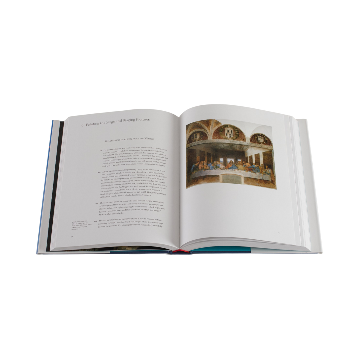 An open hardcover book showing printed text on the left page and a reproduction of Leonardo da Vinci's Last Supper on the right page, photographed against a plain white background.