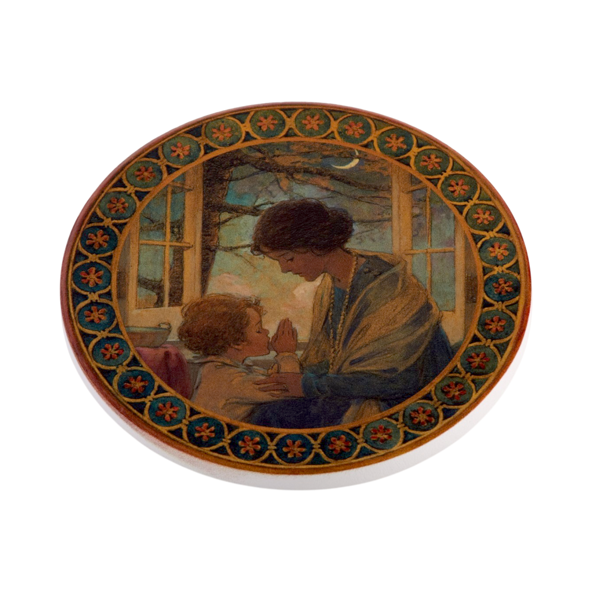 An oval decorative coaster featuring a vintage-style Jessie Willcox illustration of a woman and child by a window at night, surrounded by an ornate floral border.