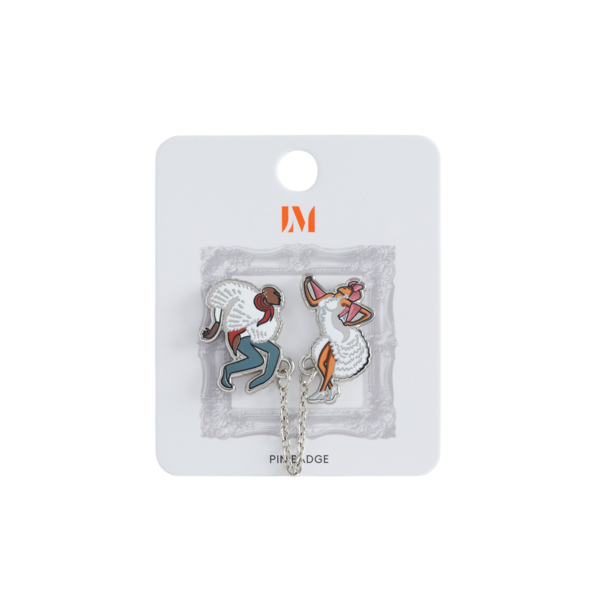 An enamel pin displayed on a white display card. The pins feature stylized figures: one bald, with a white textured fluffy coat wing, and blue pants, and one with a pink head scarf, a white dress, and white heels. This pin illustrates Miguel Covarrubias' 'Rumba 1942' illustration.