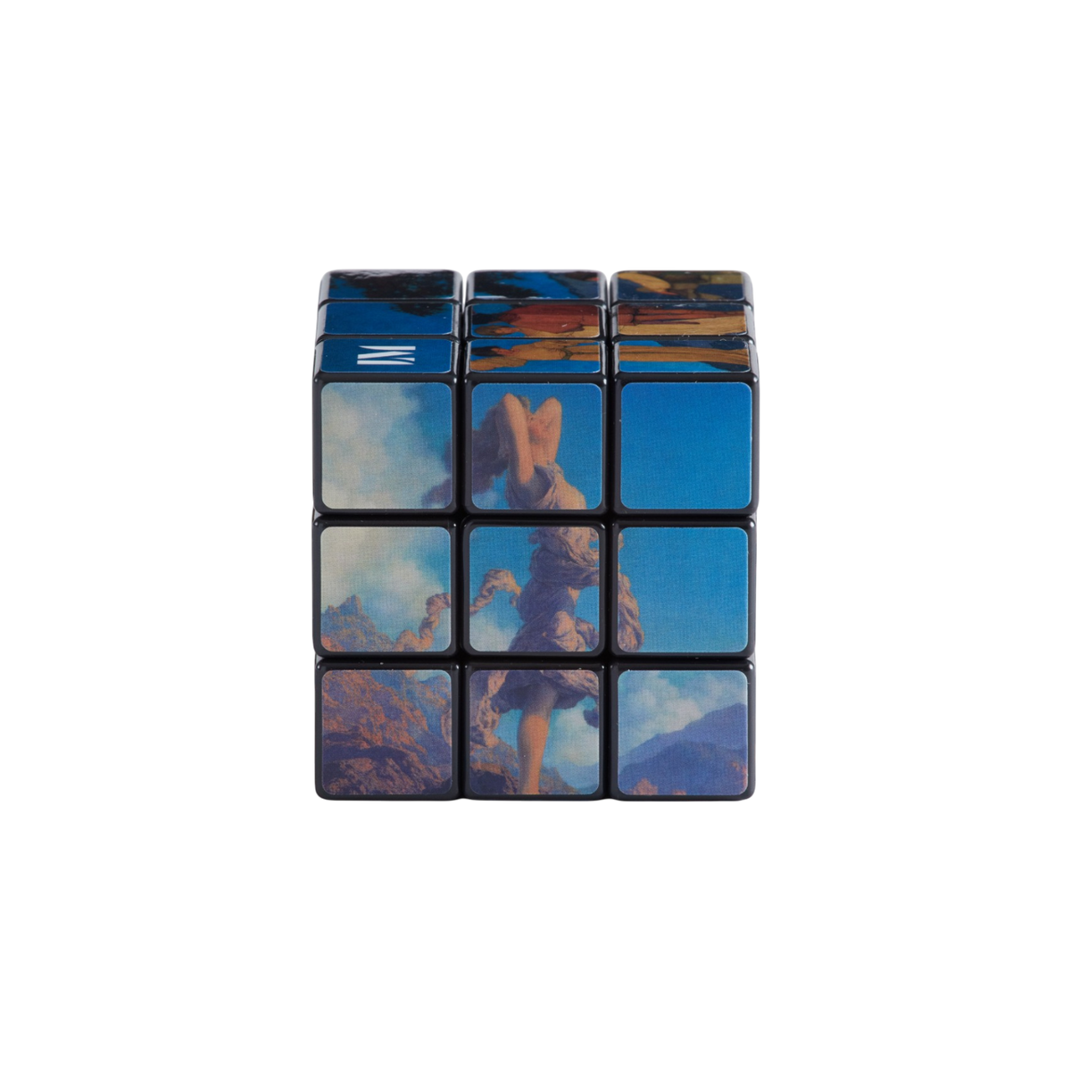 A 3x3 Rubik's cube in its original white packaging, featuring custom artwork by Maxfield Parrish. The cube itself has a black frame with six panels displaying colorful landscape paintings in shades of blue, purple, orange, and yellow.