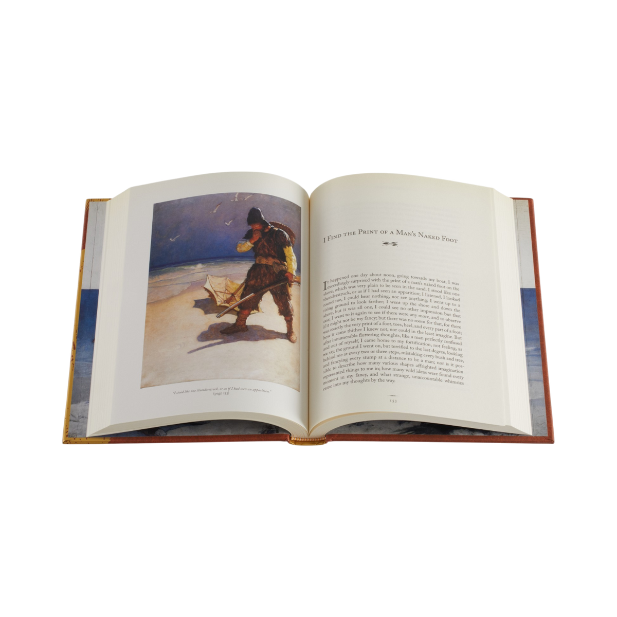 An open hardcover book displayed against a solid white background, showing two printed pages with an illustration of a man on a beach and a block of text.