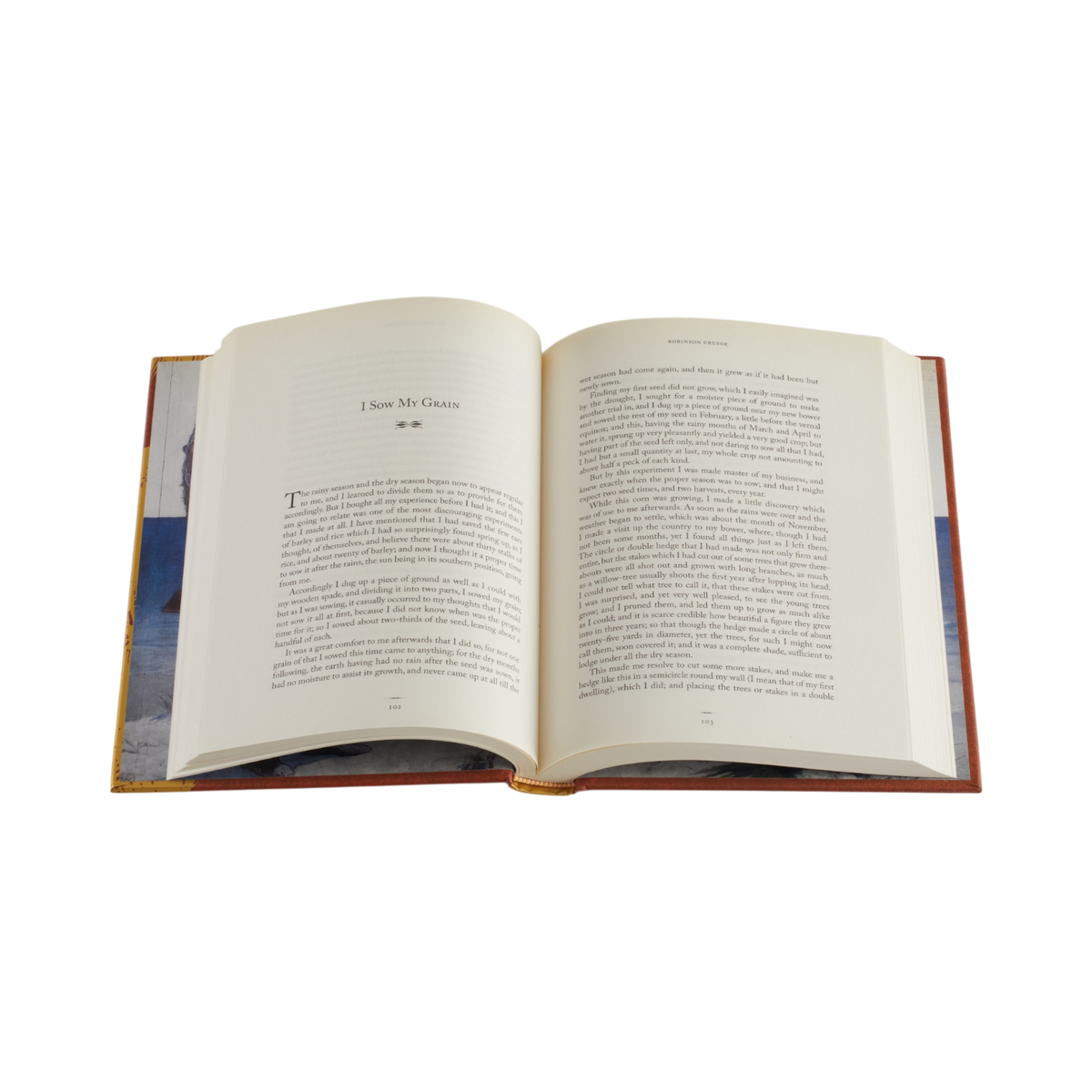 An open hardcover book with cream-colored pages and printed text, set against a solid white background.