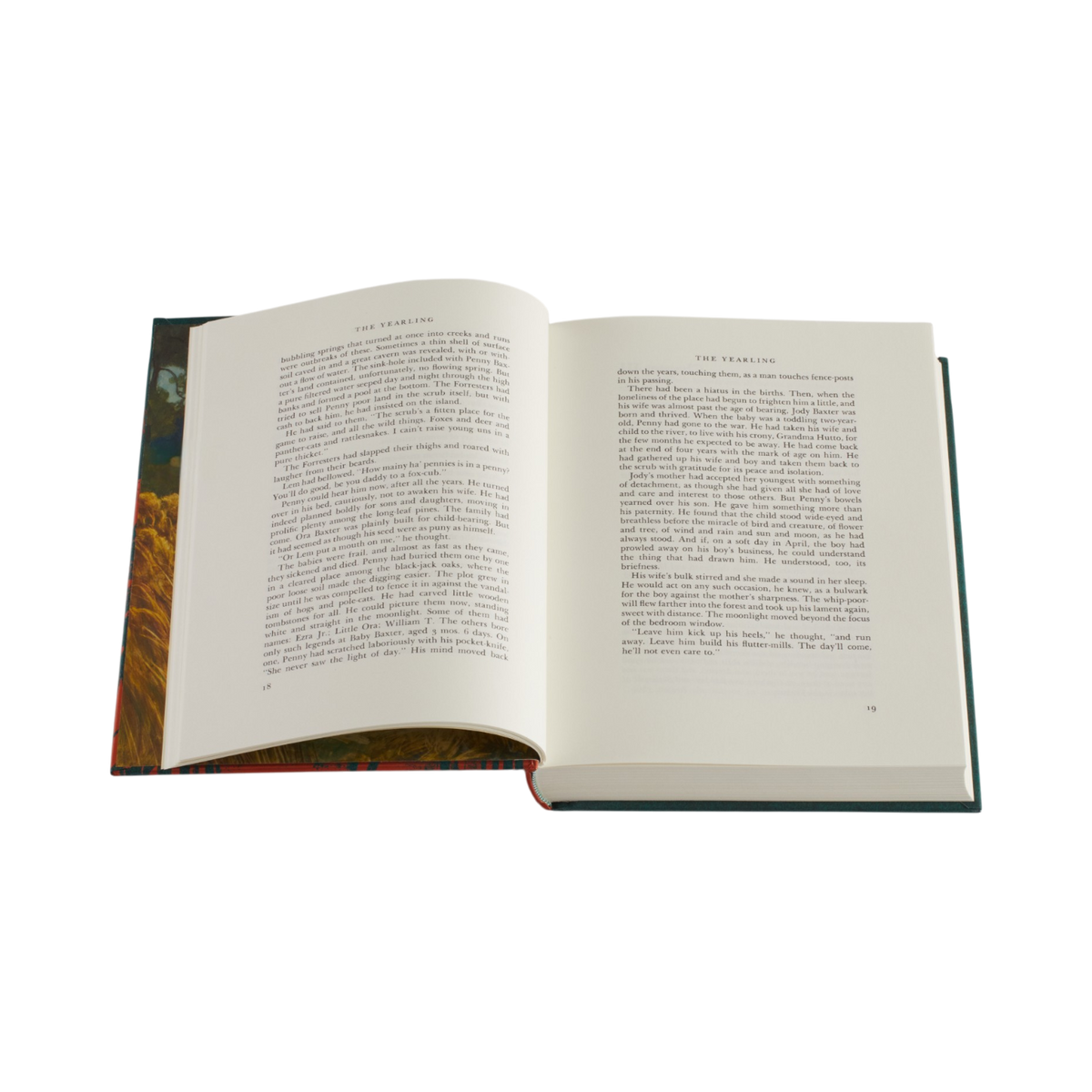 An open hardcover book with two open pages displaying printed text, photographed against a solid white background.